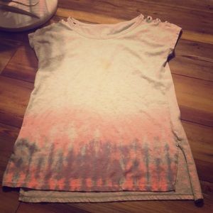 One sunset color shirt and one rug rats shirt